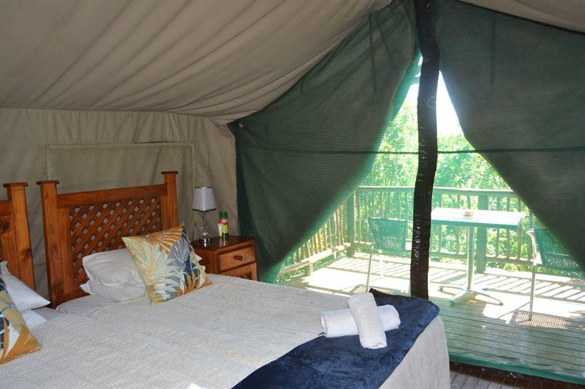 A Bush Camp safari tent seen from its timber deck.