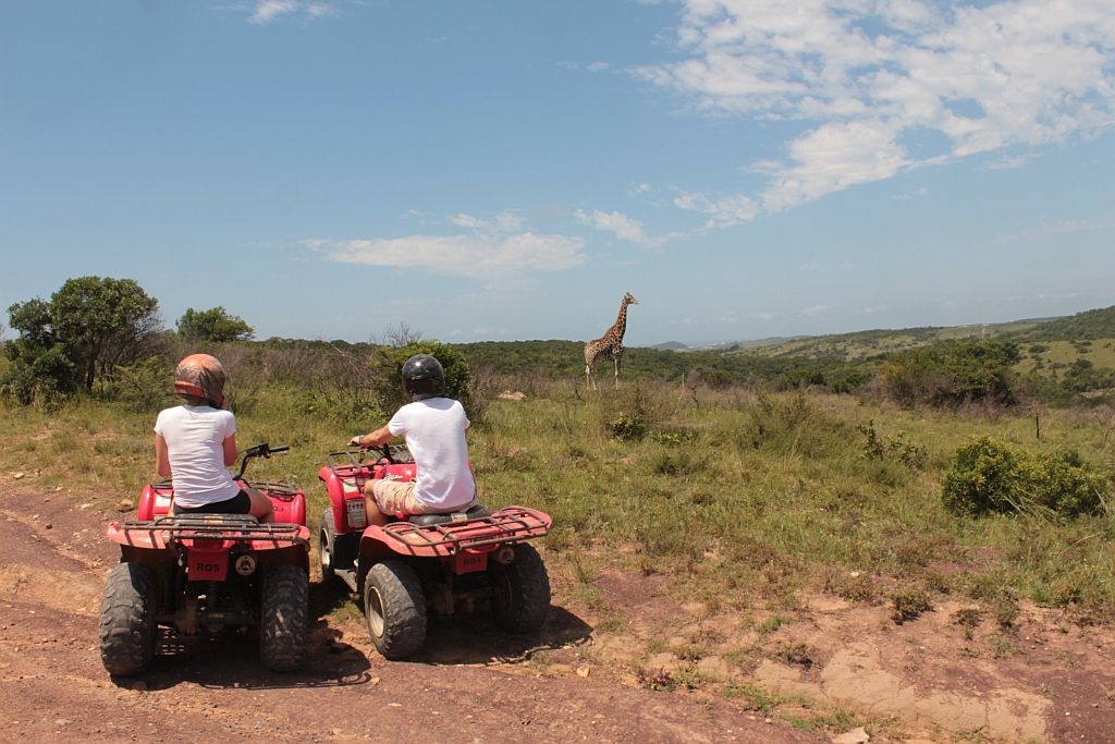 A group setting out on quad bikes for a team activity at Inkwenkwezi.